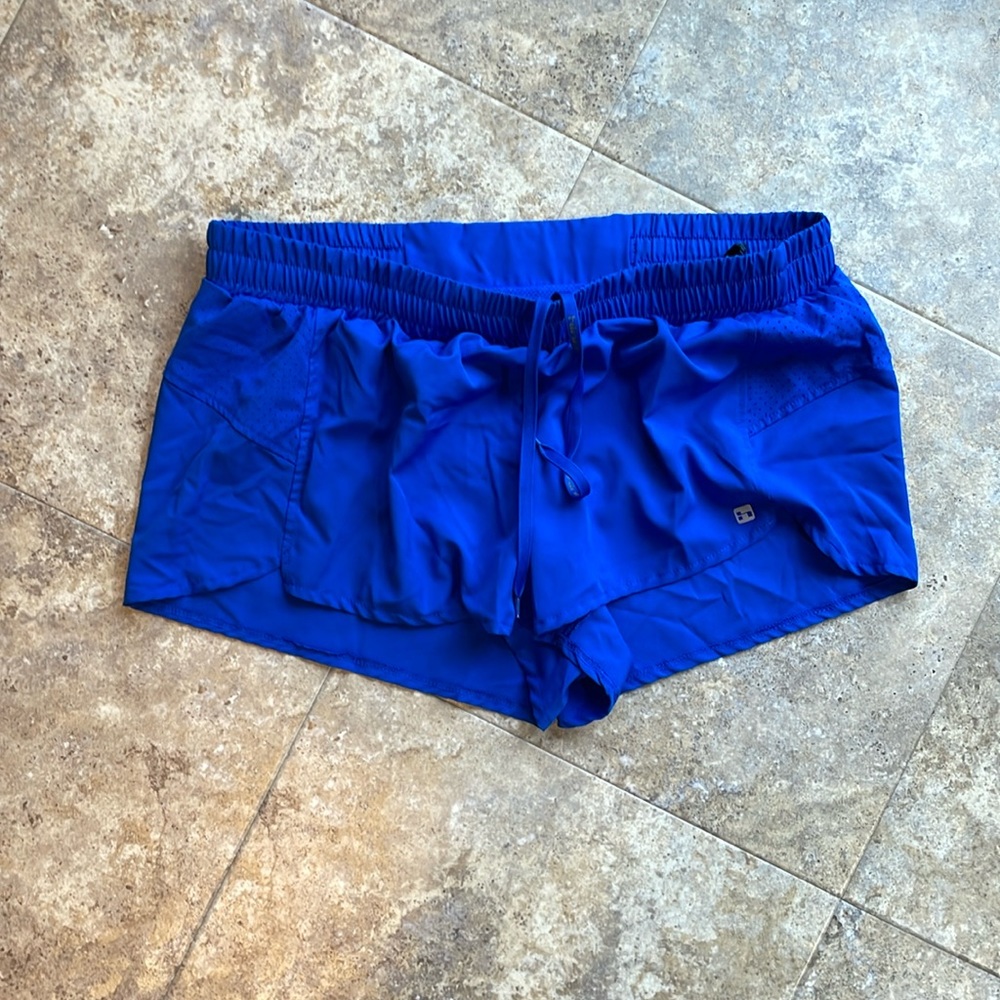Women’s Hind XL Royal blue running shorts with built in brief. Never worn/washed